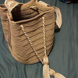 Woven shoulders purse. Great quality. Great gift, cute for pictures.
